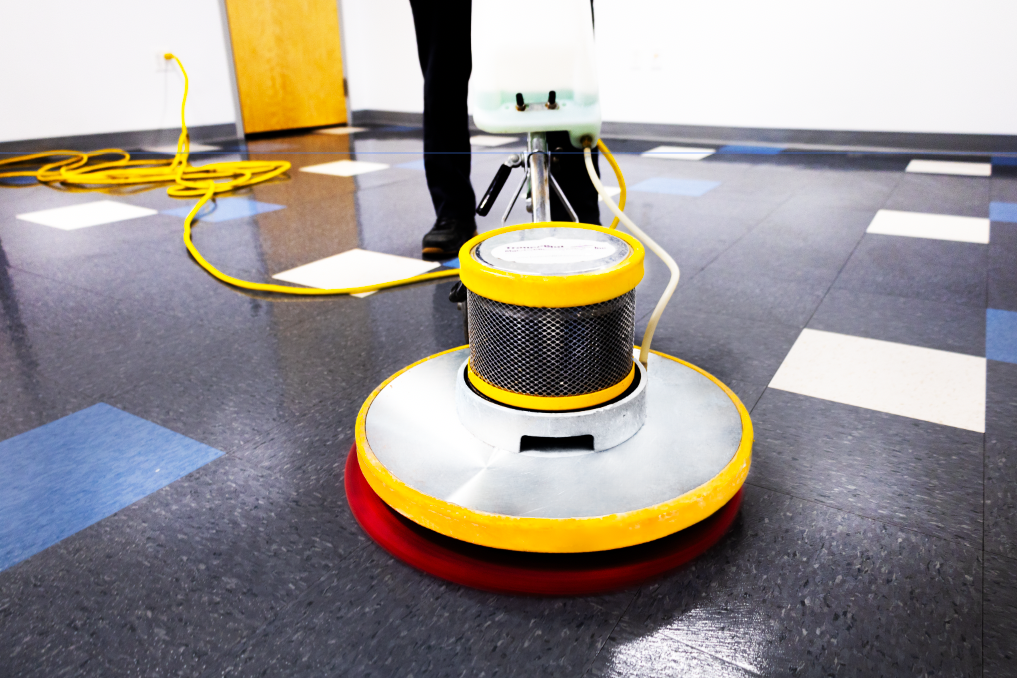 Commercial floor buffer restoring shine to a tile floor